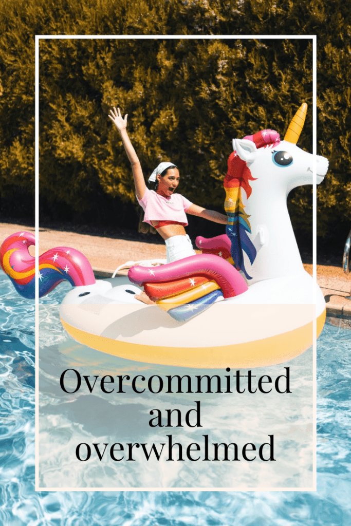 title image - woman cheering whilst riding inflatable unicorn across a swimming pool